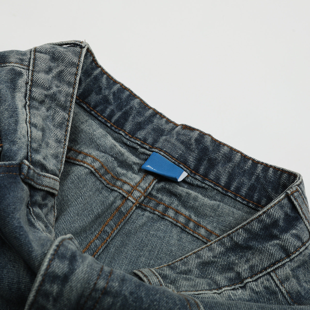 Blue Orbiform Arc Statement Denim